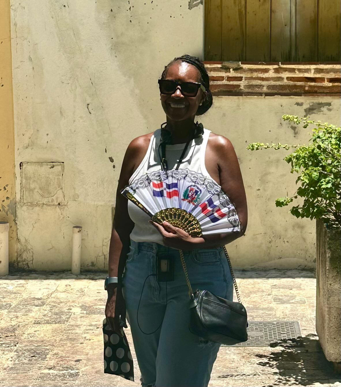 Arliee with a Dominican flag fan in Santo Domingo